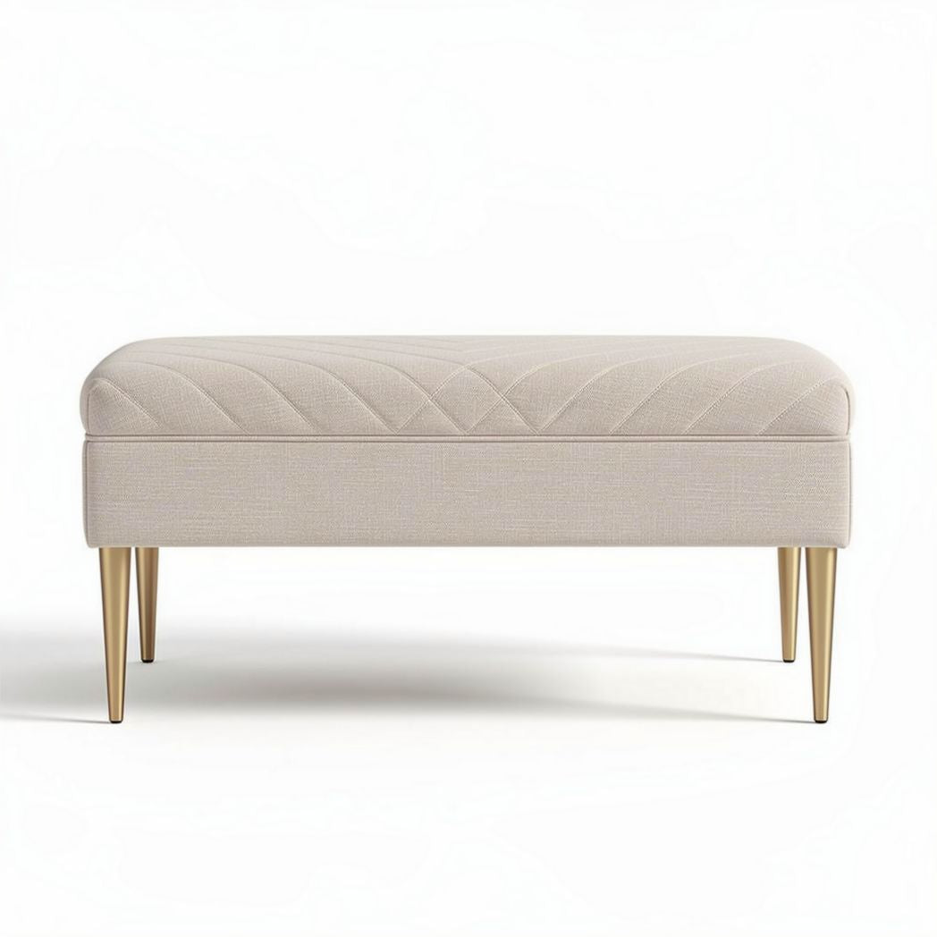 Upholstered ottoman in beige fabric with gold metal legs 80 x 40 x 30cm