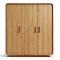 Wooden wardrobe with decorative design and four doors in natural finish